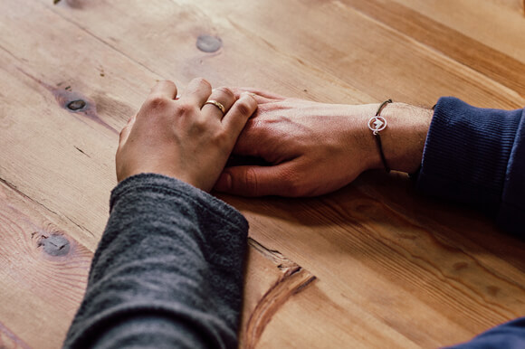 Couple holding hands