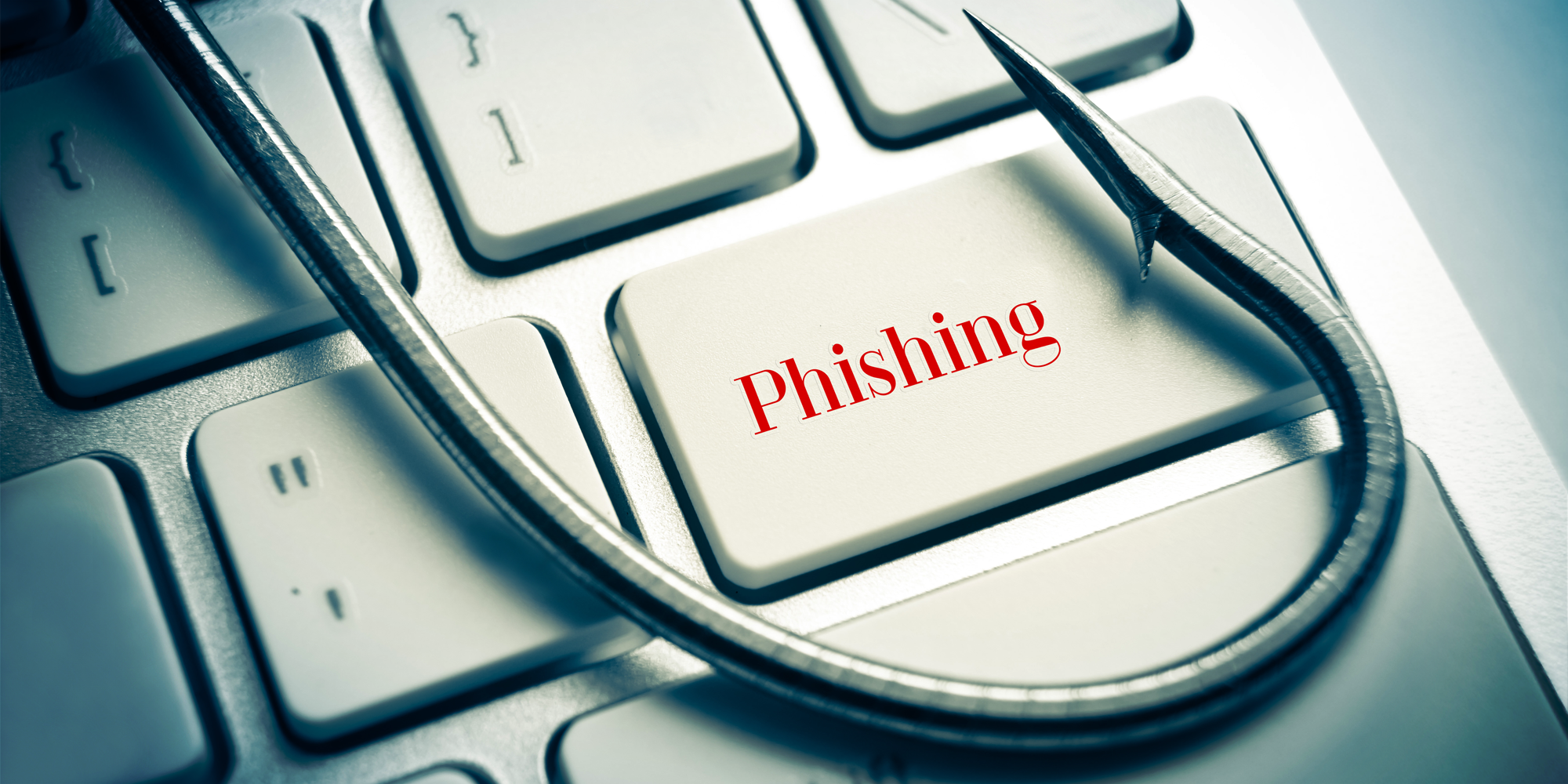 Fishing hook on keyboard. Highlighted key says "phishing"
