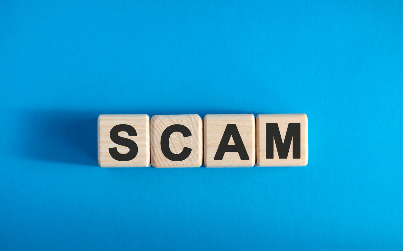 scam written out on blue background